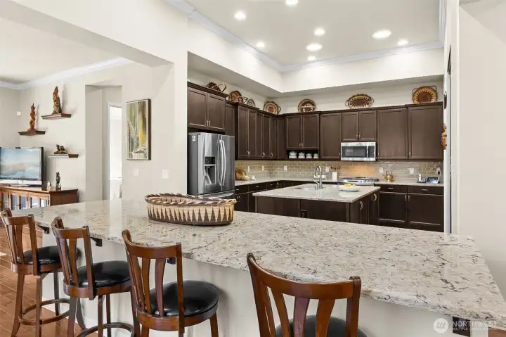 Expansive open kitchen with bar seating