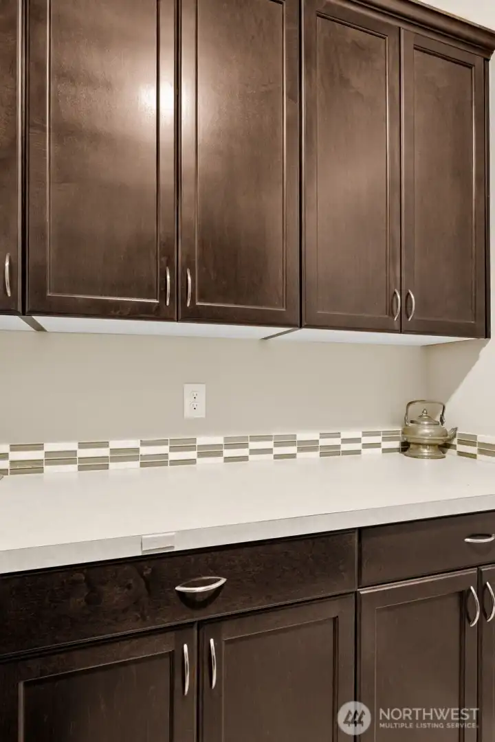 Custom cabinets in laundry for extra storage.