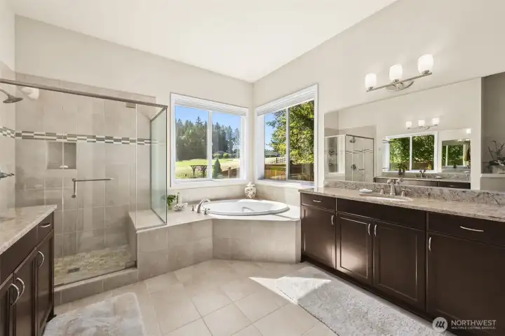 2 extra large vanities adorn the primary bathroom.