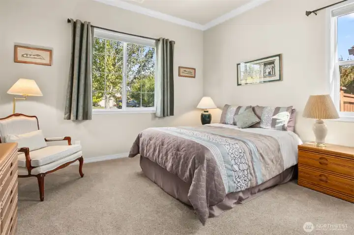 Guest suite with full bathroom is at opposite side of house from primary