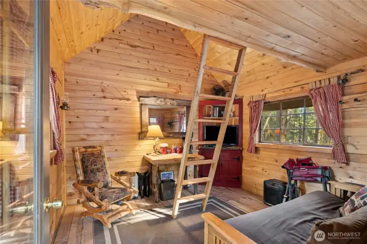 Finished with t&g wood millowork, a corner cabinet/media console and a sleeping bunk.