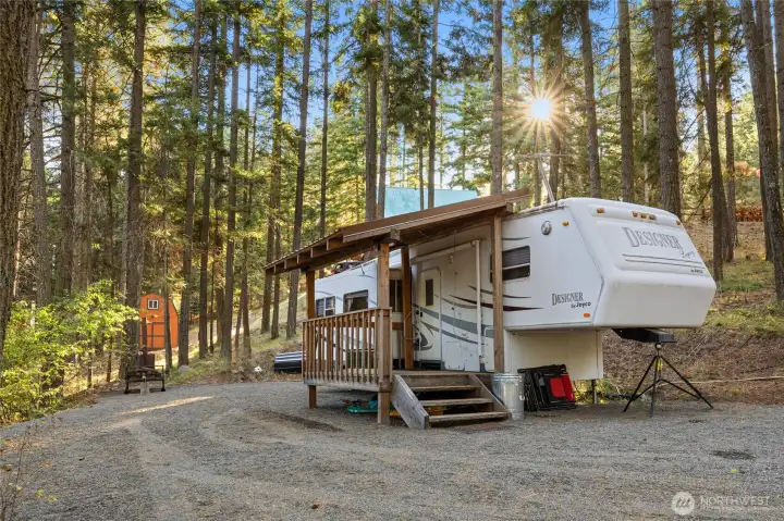 The 2001 Jayco with covered deck will stay.