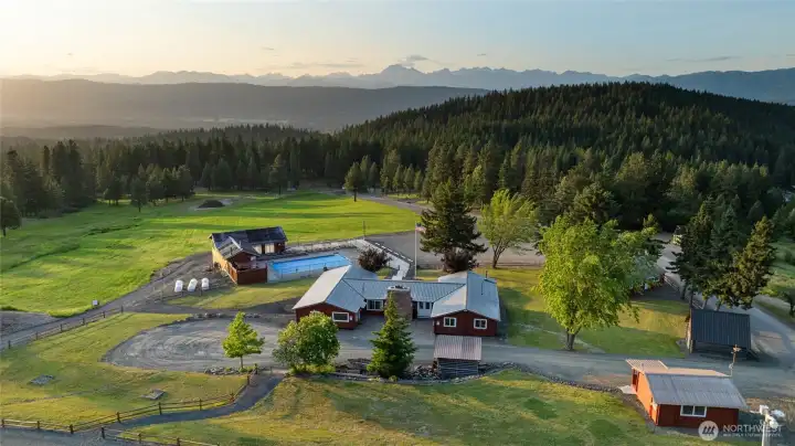 Aerial view of the Sky Meadows community lodge and infamous Stewart Mountains in the background.