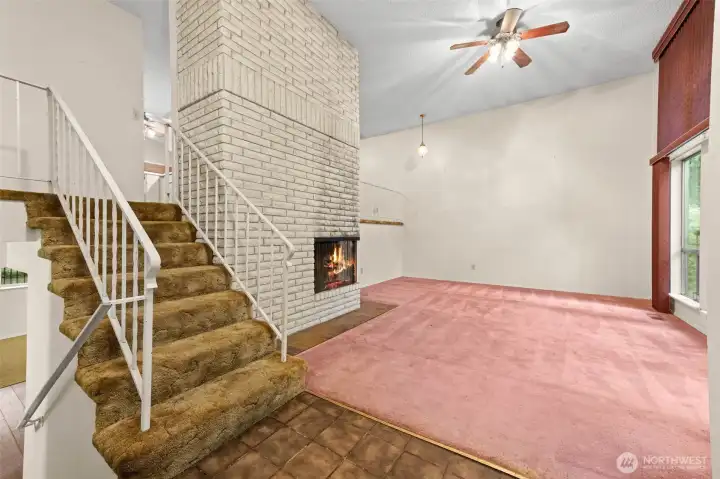 Enter into this tri-level home to a large living room with amazing floor to ceiling windows and a two story fireplace.