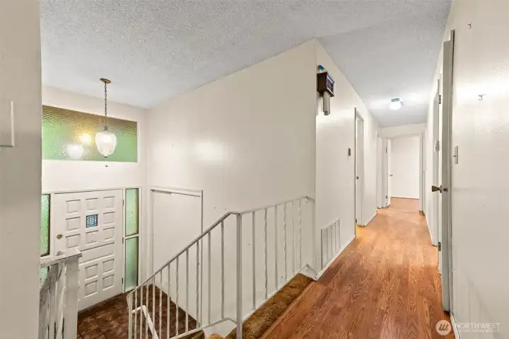 Hallway to the three bedrooms and full bath.