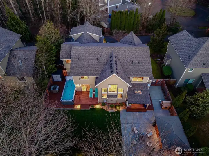 This setup feels like your own private little resort moment. The swim spa is wrapped in Trex decking, so it looks sharp and holds up to real life, and it sits just off the main floor junior suite which makes late night dips or slow mornings ridiculously convenient. There’s plenty of room on the opposite side for outdoor seating, so you can actually hang out here, not just pass through. Add in extra space for storage and you’ve got a backyard zone that’s equal parts relaxing and practical.