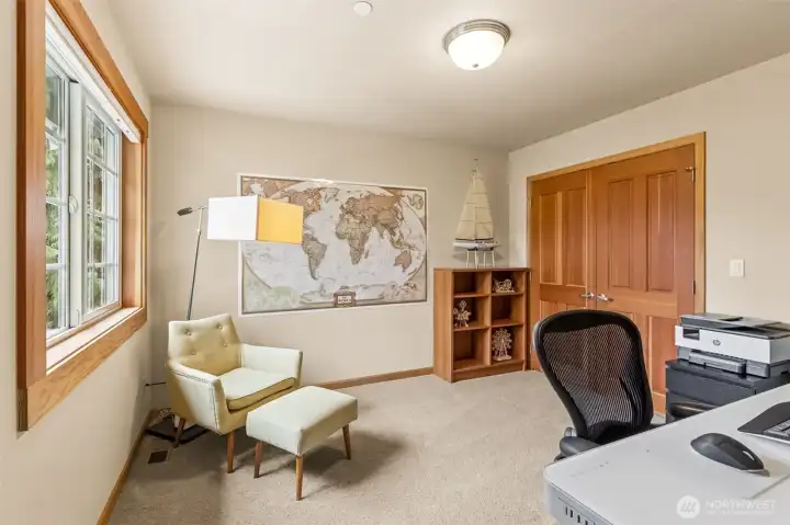 This upstairs office keeps things simple and super usable. About 11’x11’9”, it’s a legit room, not an afterthought, and easily flexes into a 4th bedroom if that’s on your list. The French door closet with built-ins keeps storage dialed in, and the wood wrapped windows bring in that warm detail you see throughout the home. Soft neutral tones make it easy to picture desks, beds, or both, depending on how your life is set up right now.