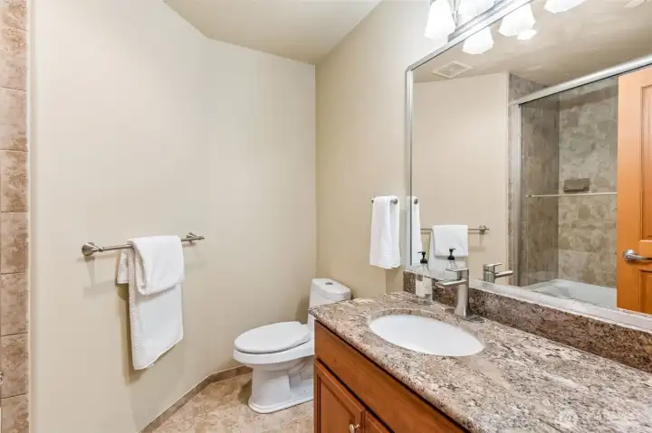 This is the kind of upstairs bathroom that just makes life easier. Long granite counter, plenty of space for everyone’s stuff, and an undermount sink that keeps things looking tidy. Tub and shower combo for flexibility, and it’s perfectly placed to serve both the 3rd bedroom and the office or 4th bedroom. It’s living well in a shared bathroom that actually works.
