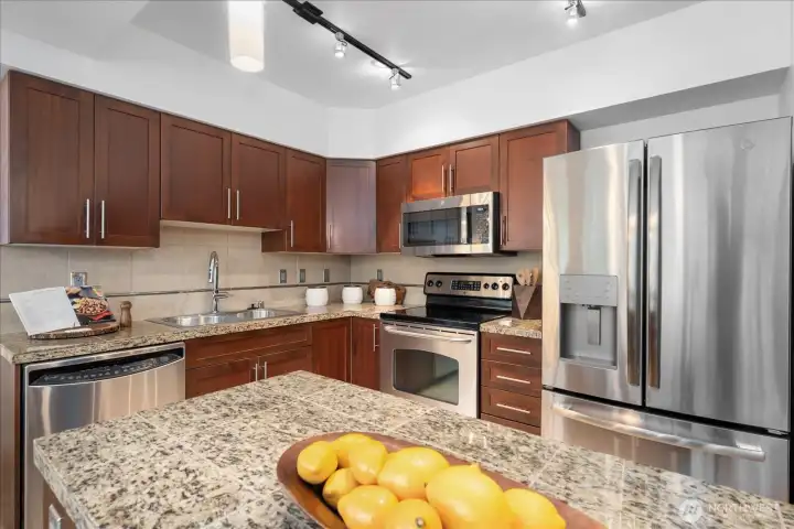 Well appointed kitchen with generous cabinetry and workspace