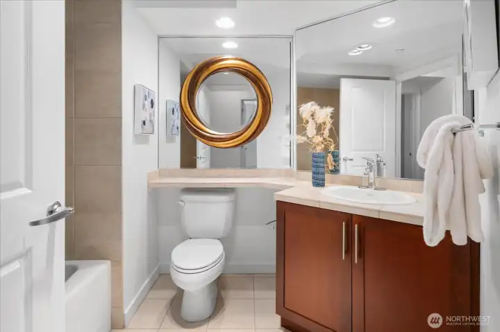 Full guest bathroom with  clean finishes