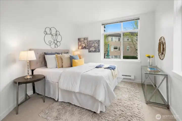 Serene primary suite with generous proportions and natural light.