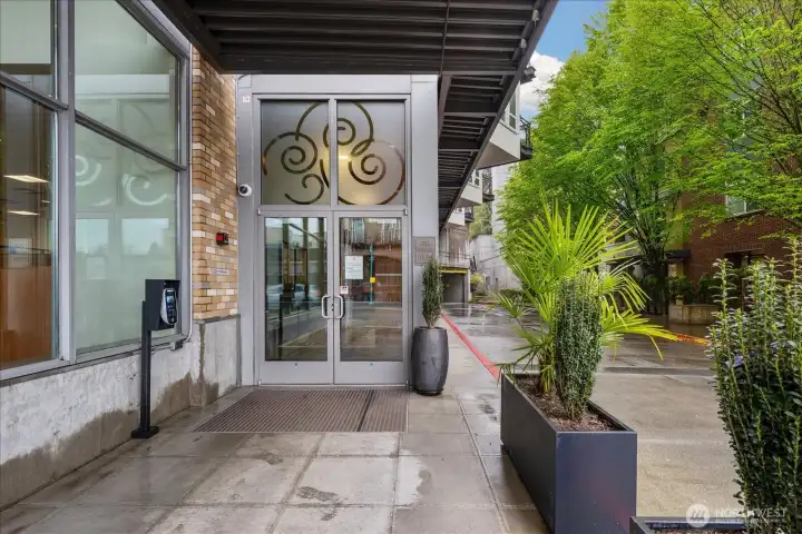 Welcome street level entry in a vibrant neighborhood setting