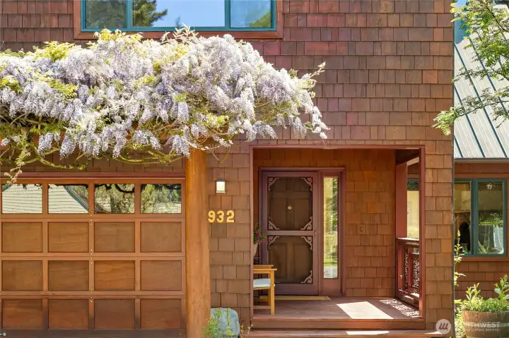 Covered porch and gorgeous wisteria vines!
