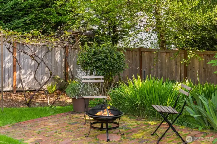 Brick patio provides another outdoor gathering space.