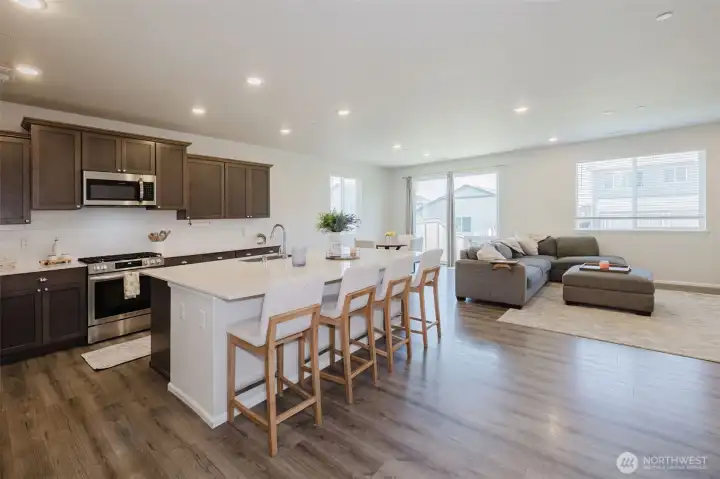 THIS ISLAND! It is massive! The open floor plan makes entertaining a breeze. THIS ISLAND! It is massive! The open floor plan makes entertaining a breeze.
