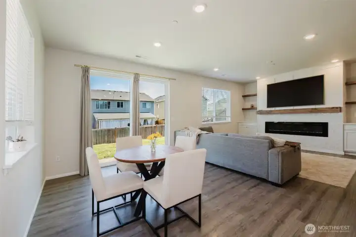 Dining area with living room space beyond. And all the natural light! Dining area with living room space beyond. And all the natural light!