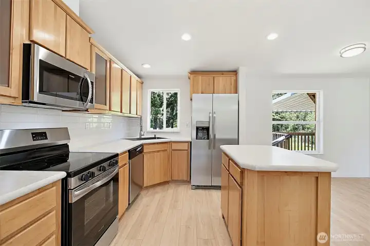 Kitchen with new stainless appliances. Kitchen with new stainless appliances.