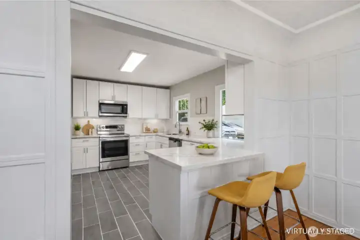 Modern Kitchen with breakfast eating area open to the dining area Modern Kitchen with breakfast eating area open to the dining area