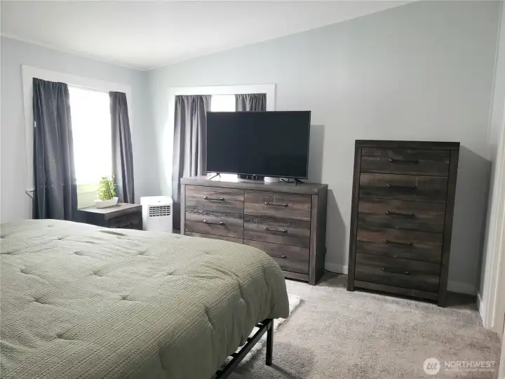 A Picture of the Large Primary Master Bedroom showing New Interior Paint, White Painted Trim and the New Carpet Flooring. A Picture of the Large Primary Master Bedroom showing New Interior Paint, White Painted Trim and the New Carpet Flooring.