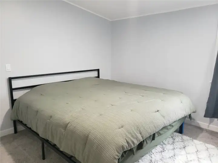 Another Picture of the Large Primary Master Bedroom showing New Interior Paint, White Painted Trim and the New Carpet Flooring. Another Picture of the Large Primary Master Bedroom showing New Interior Paint, White Painted Trim and the New Carpet Flooring.