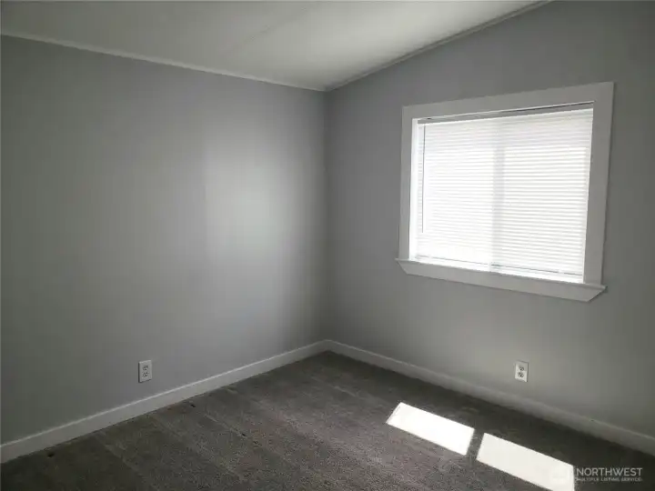 Another Picture of the Nice Size Second Bedroom with New White Window/Floor Trim, Closet, and New Carpeting.