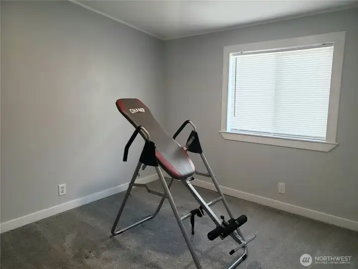 Another Picture of the Nice Size Third Bedroom with New White Window/Floor Trim, Closet, and New Carpeting.