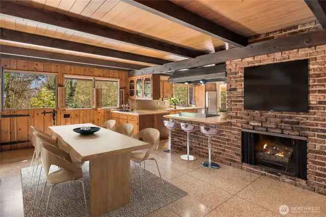 Imagine enjoying dinner in the spacious dining area, with an intimate fire crackling in the background, creating the perfect ambiance for a cozy, memorable evening. There is even a Dutch door letting the fresh breeze flow in.