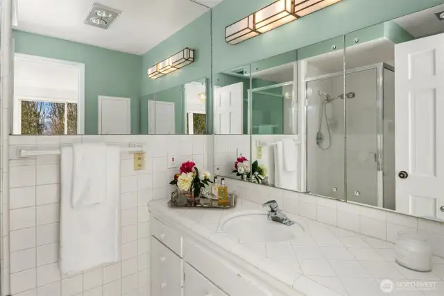 The home features two primary suites on the main level, providing exceptional convenience and flexibility for guests or multi-generational living.