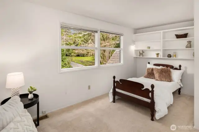 Most of the bedrooms feature walk-in closets and built-in shelving, offering ample storage space and enhancing the home's functionality and organization