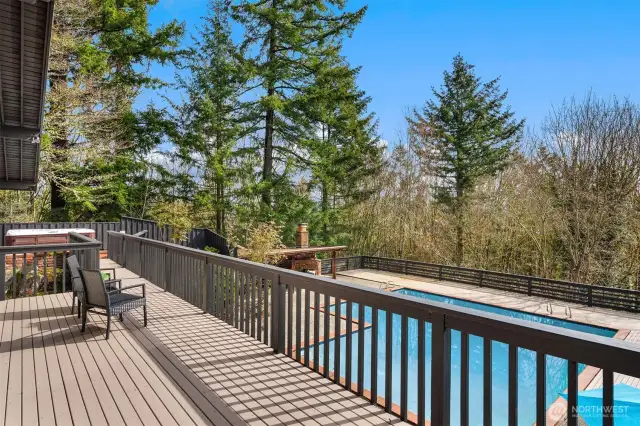 The oversized sliding door seamlessly connects indoor and outdoor living, opening to a spacious deck that overlooks your private oasis, perfect for relaxing or entertaining.