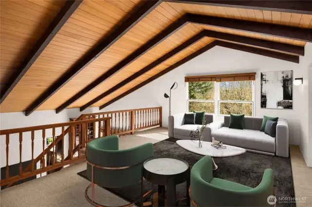 The open loft upstairs offers a versatile flex space, perfect for a home office, media room, or additional lounge area.