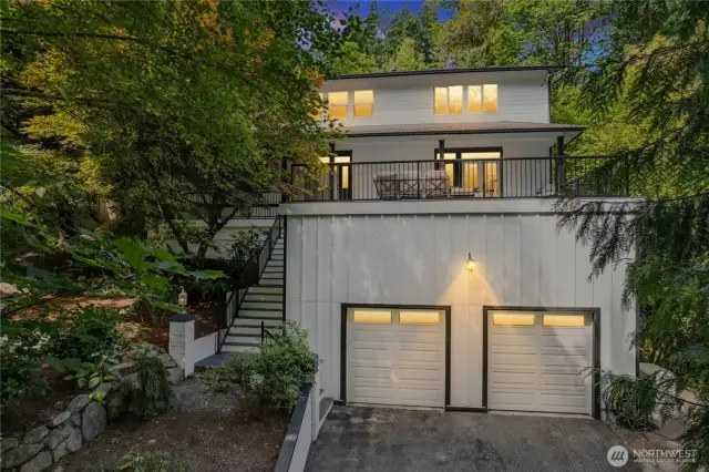 Nestled in the trees is this bright & airy home!