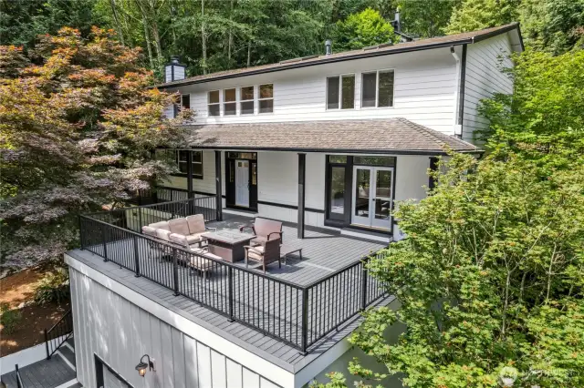 Huge front trex deck with gas BBQ line welcomes summer entertaining!