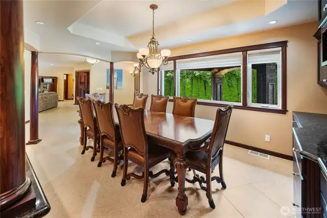 The large windows let in plenty of light to bring the rich wood tones to life, enhancing the luxurious nature of the traditional style found throughout the main level.