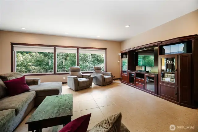 Relax at the end of the day or host large gatherings of loved ones. To the right is the entrance to the Jack & Jill Bedrooms, and to the left is one entrance to the kitchen.