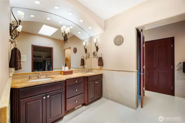 The luxurious 5-piece ensuite includes a double vanity, jetted tub, walk in closet, and walk in shower.