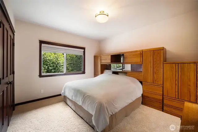 Third upper bedroom, currently with a King bed set.