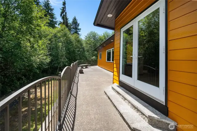 The back deck is well suited for morning coffees, summertime bbqs, or hosting a large gathering.