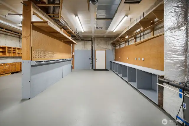 Lower workshop space. The heat pump makes for efficient winter heating and staying cool in the summer. The blackberries are ripe and delicious in the summertime, too.
