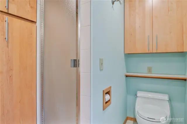 primary bathroom with walk in tile shower