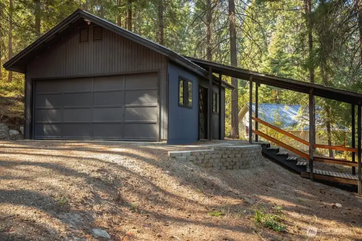 Two car garage with additional garage door on the back