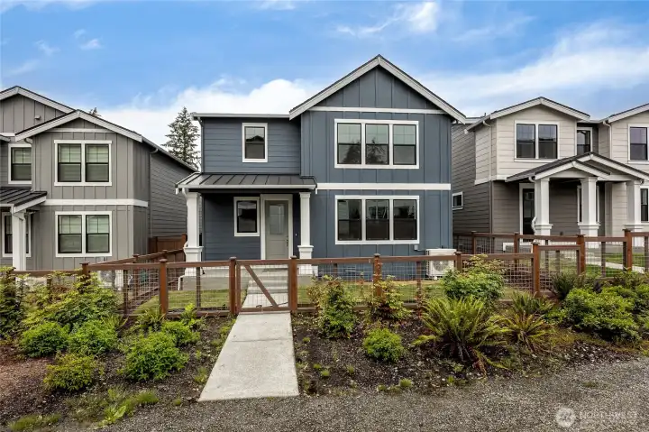 Fully fenced yard with a gate opens to community walking path. Photo is representational. Actual home is under construction and finishes and paint colors may vary. See site agent for details.... Fully fenced yard with a gate opens to community walking path. Photo is representational. Actual home is under construction and finishes and paint colors may vary. See site agent for details....