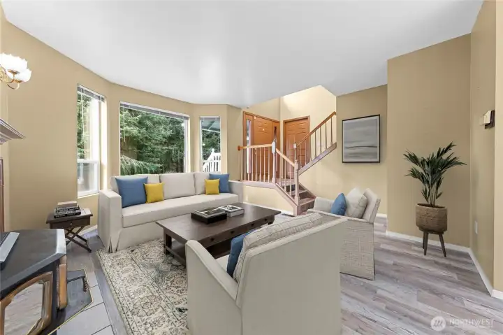 Nice and open with newer LVP flooring~This pellet stove is amazing and can heat the home too!