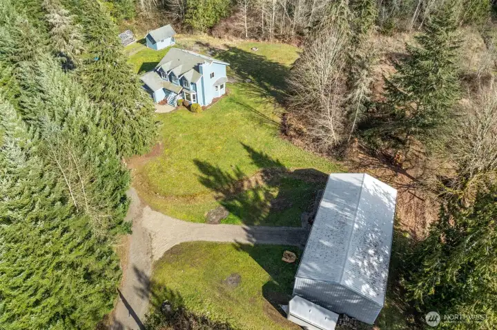 Nice drone shot of the house and detached garage