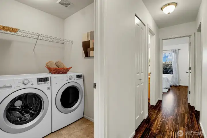 Laundry room upstairs with 3 bedrooms