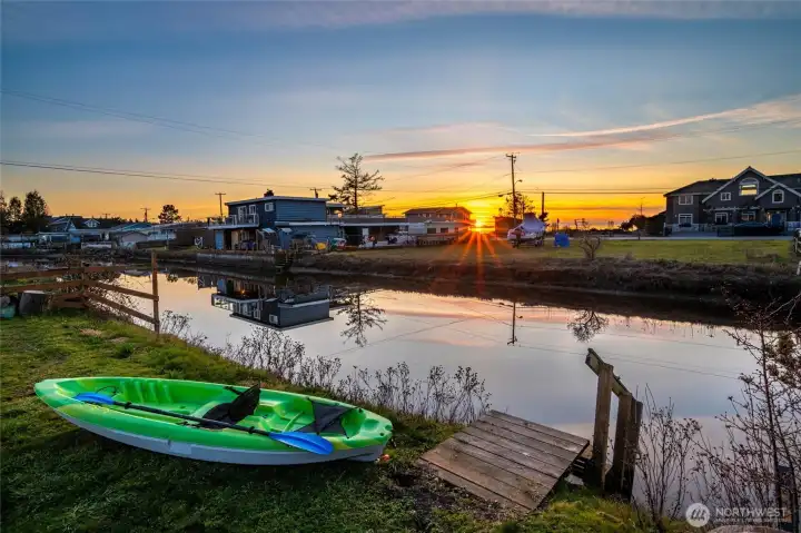 Evenings here are something special. With open western exposure across neighboring vacant lots, you’ll enjoy glowing sunset views reflecting over the water, whether relaxing by the fire pit, unwinding in an Adirondack chair, or paddling back in from an evening on the water.