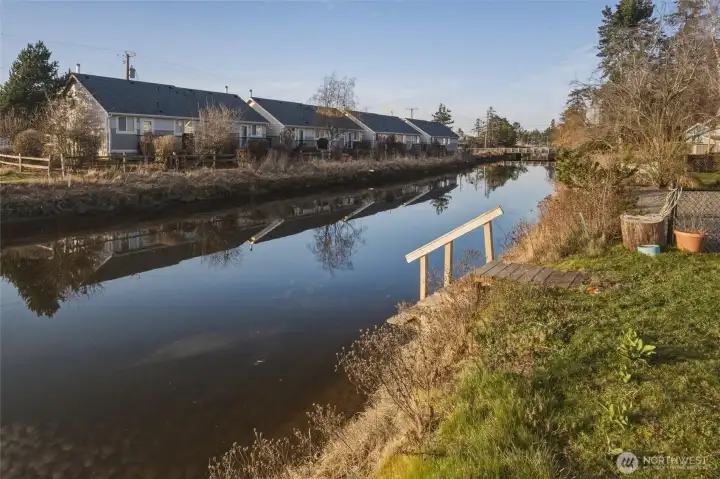 A set of private steps leads directly down to the creek, making it effortless to launch your kayak or paddleboard.