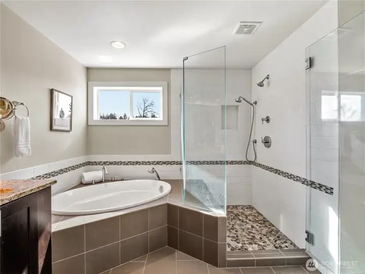 Transform your daily routine into a five-star spa experience with heated floors, soaking tub and shower with large built-in bench
