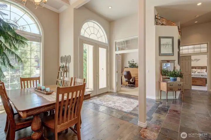 IElegant dining room with tray ceiling detail, ideal for hosting gatherings and holiday meals.