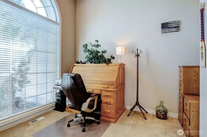 Dedicated office or den with closet, perfect for remote work or potential fourth bedroom.